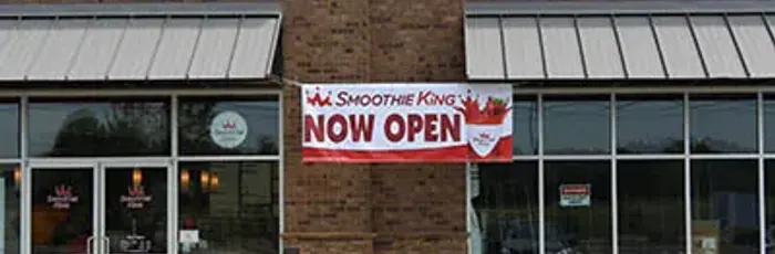 Custom storefront banner made and installed by All-Brite