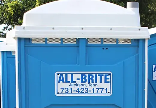 Larger ADA-accessible All-Brite portable toilet unit at an event