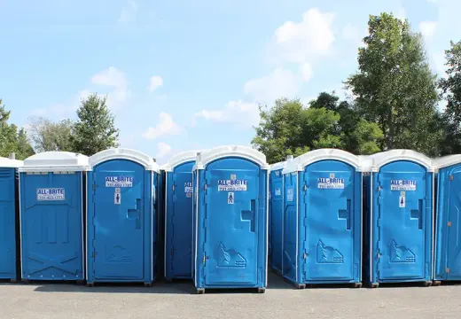 All-Brite portable toilets set up at an outdoor event