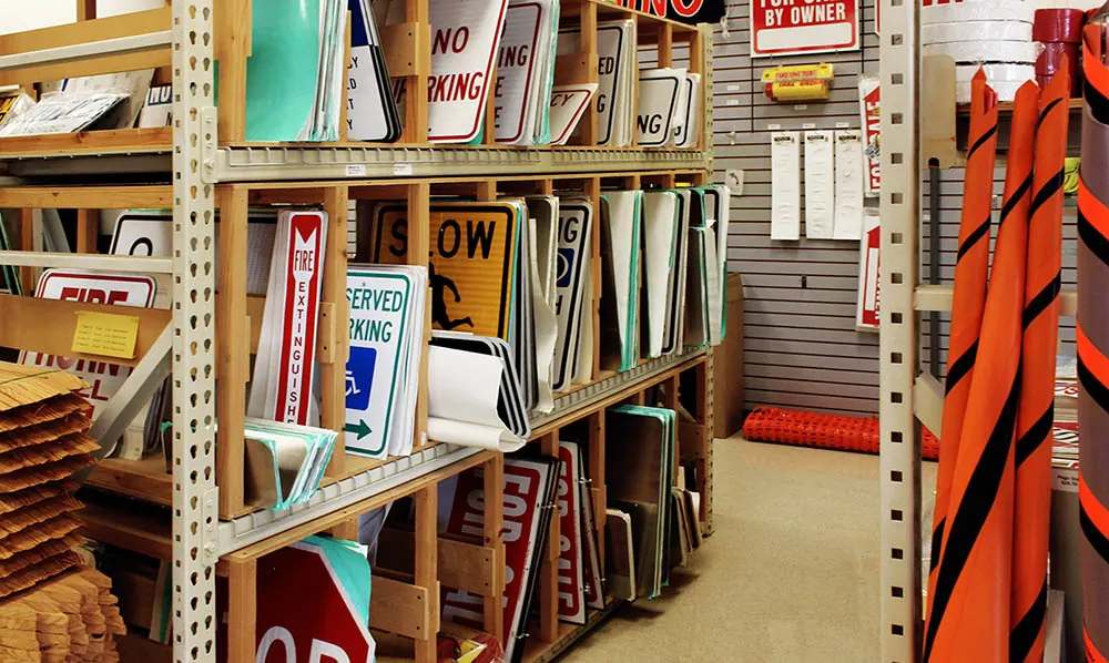 Racks of signs inside the All-Brite custom sign shop